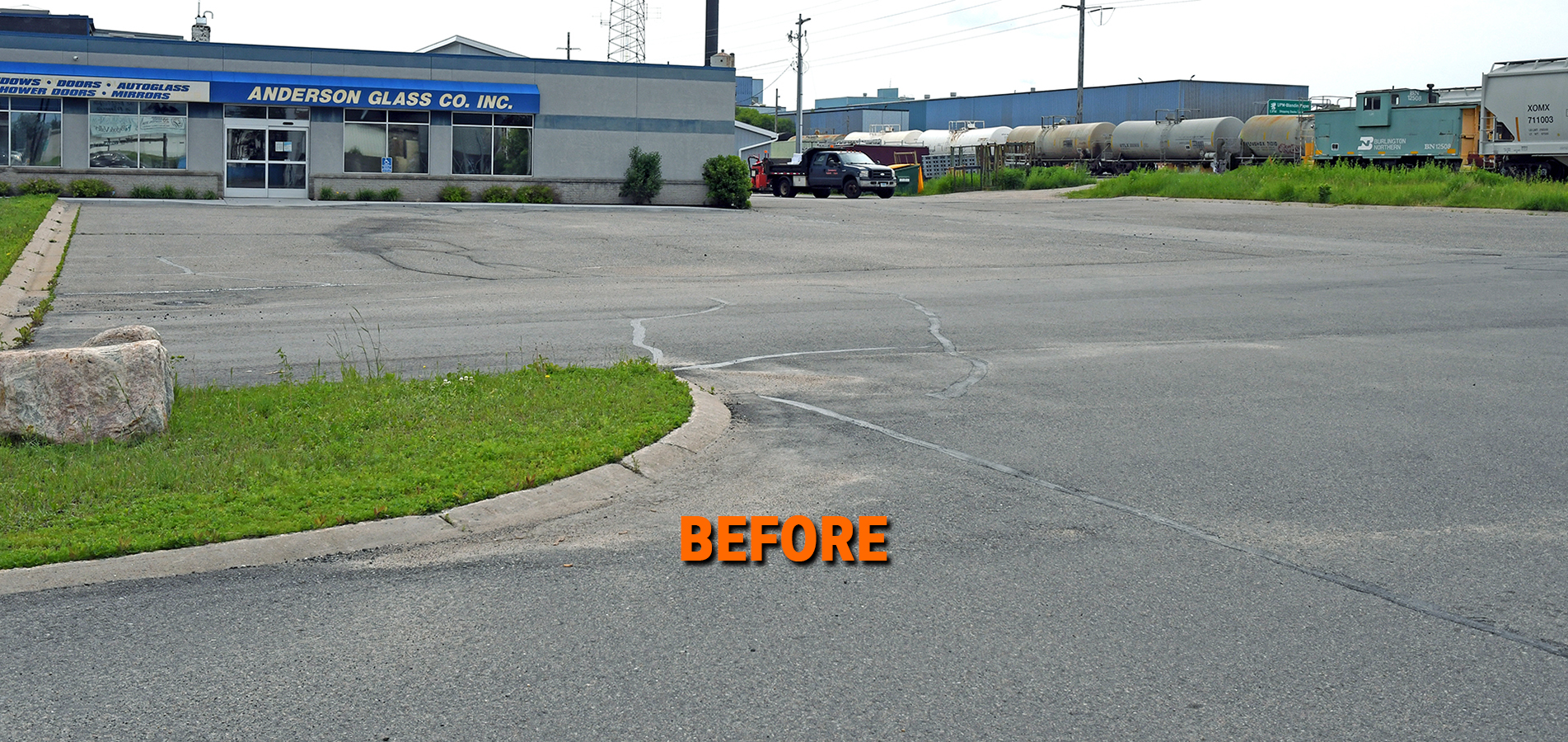 Business parking lot before sealcoating by Commercial Asphalt Repair.