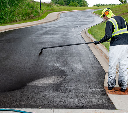 Professional Sealcoating of parking lots and driveways in Grand Rapids MN and surrounding 125 mile area.
